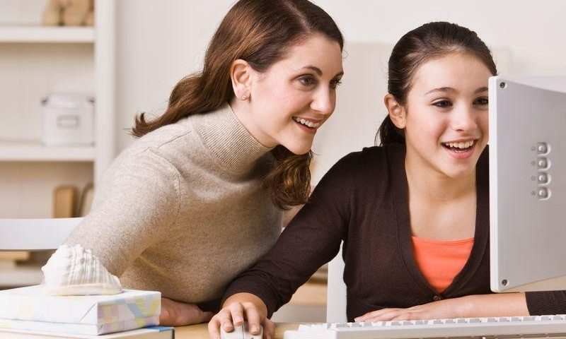 Mother able to listen in during her daughters online tutoring lesson